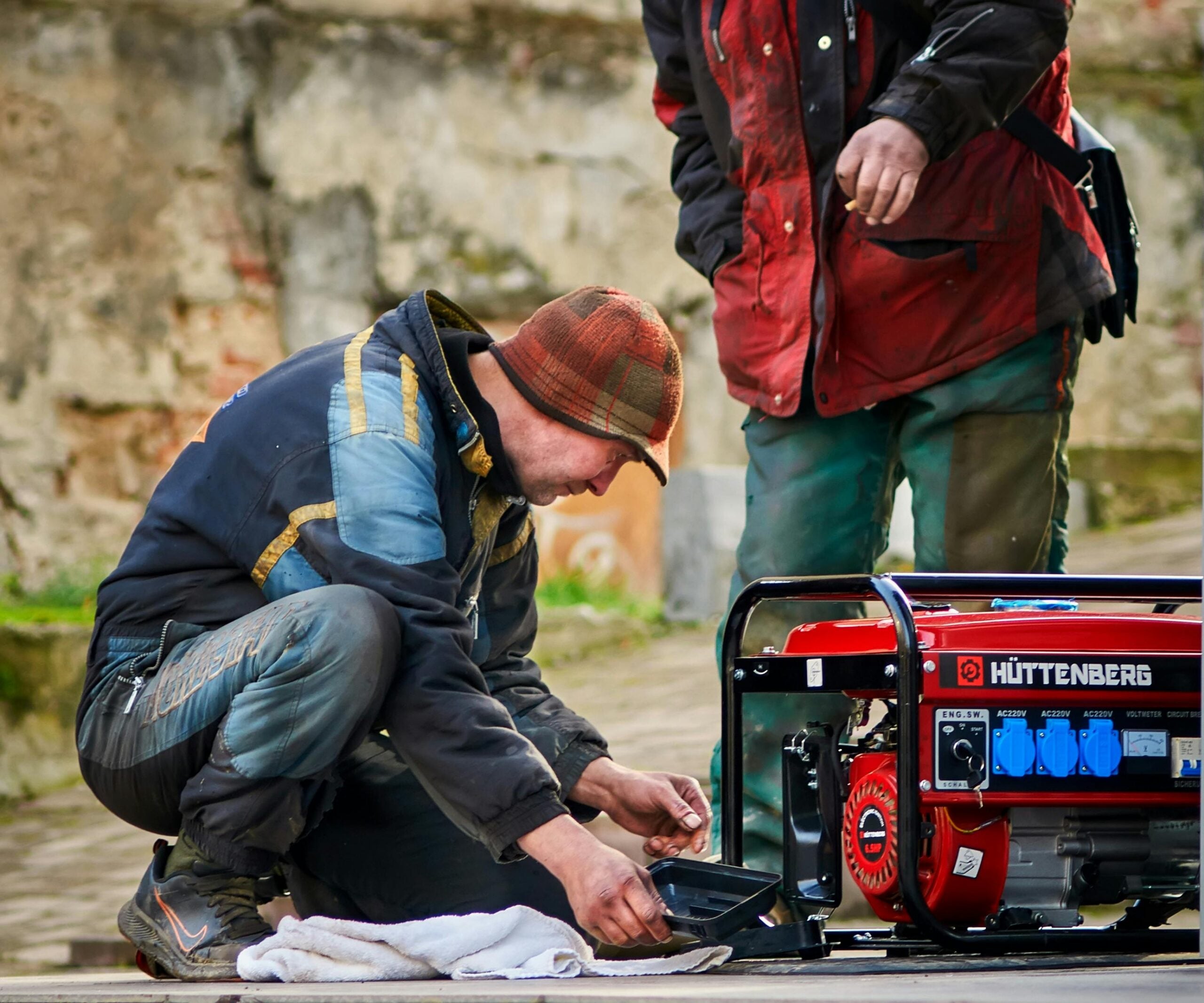 Photo by igovar igovar: https://www.pexels.com/photo/technicians-tinkering-with-a-power-generator-18816918